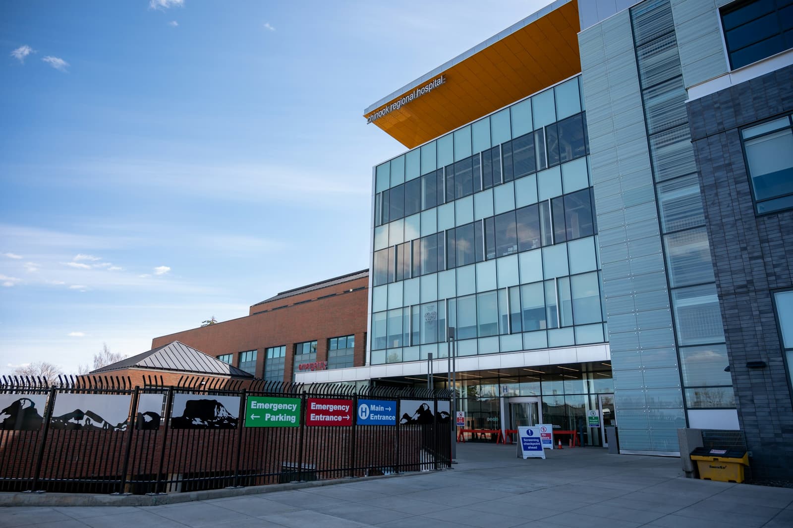 Hospital exterior with emergency entrance signage